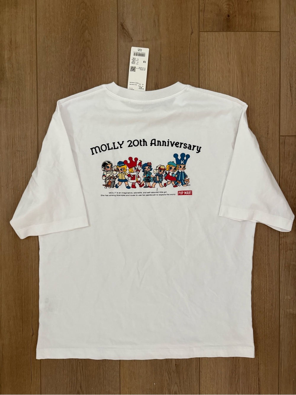 Uniqlo White Kids Tee with Small Colorful Character Print - Picture 2 of 3